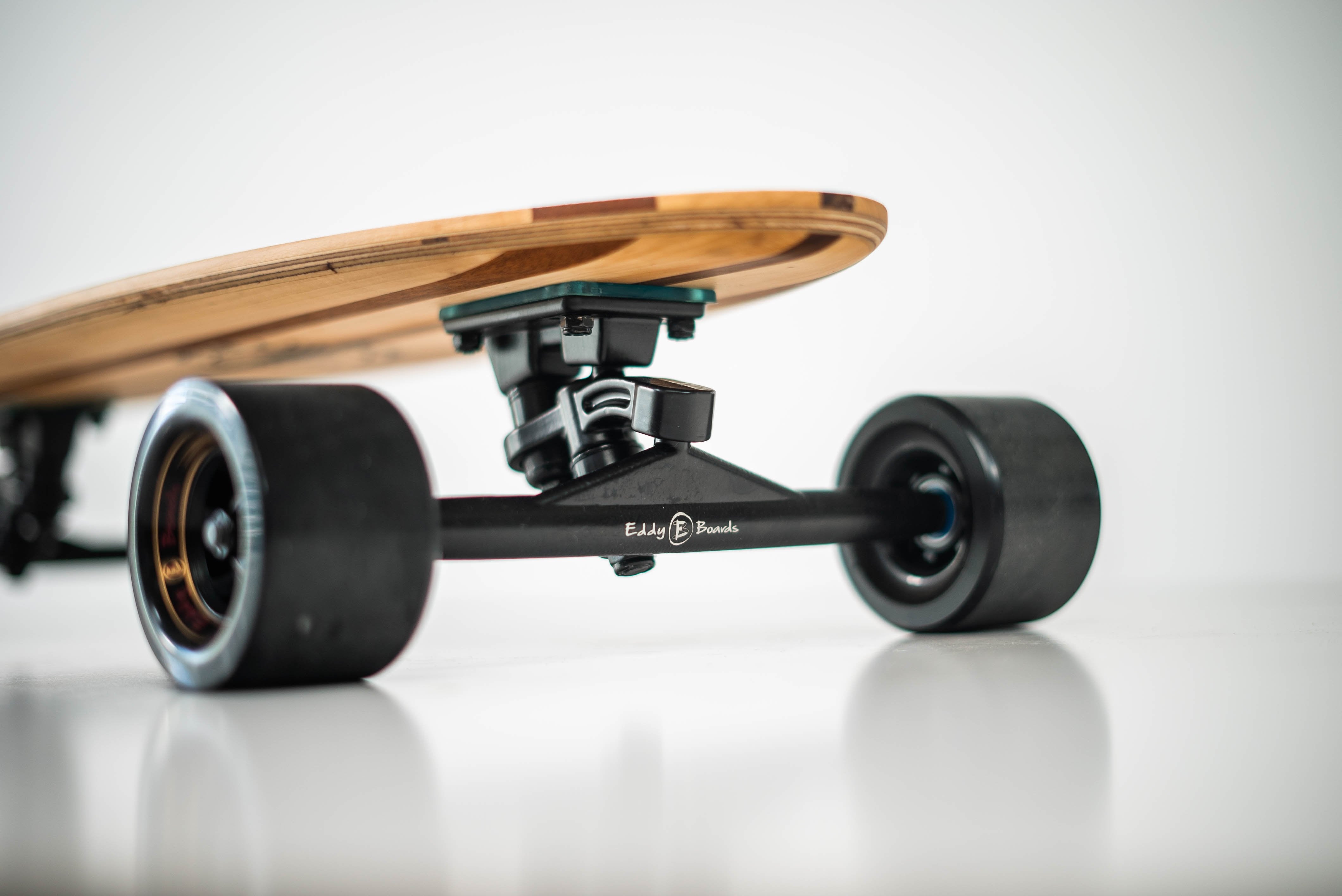 TRAVELER:  is a great Skateboard for Carving, commuting, skateboarding tricks, its size and portability makes it a great Skateboard to carry anywhere when traveling.  Available in 35" in length.   Comes with Dual Kingpin 12" wide Trucks and EddyBoards 83mm 78aa wheels.